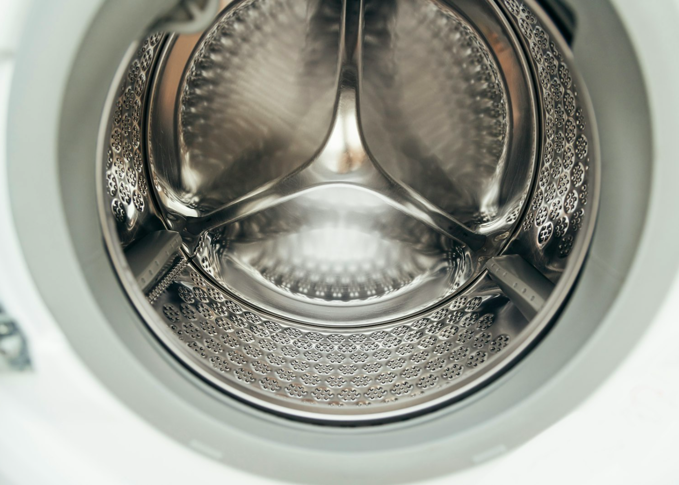 Open washing machine drum during a bearing repair